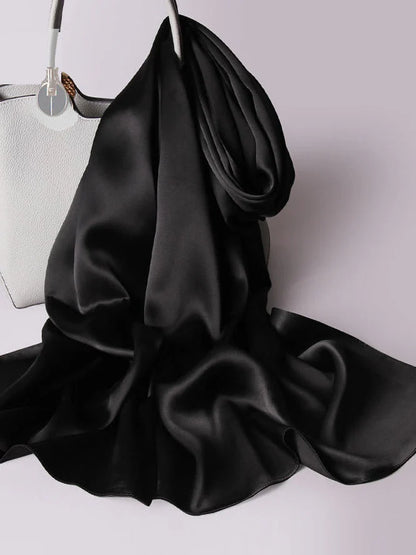 Black satin scarf/shawl with draped folds and lustrous sheen