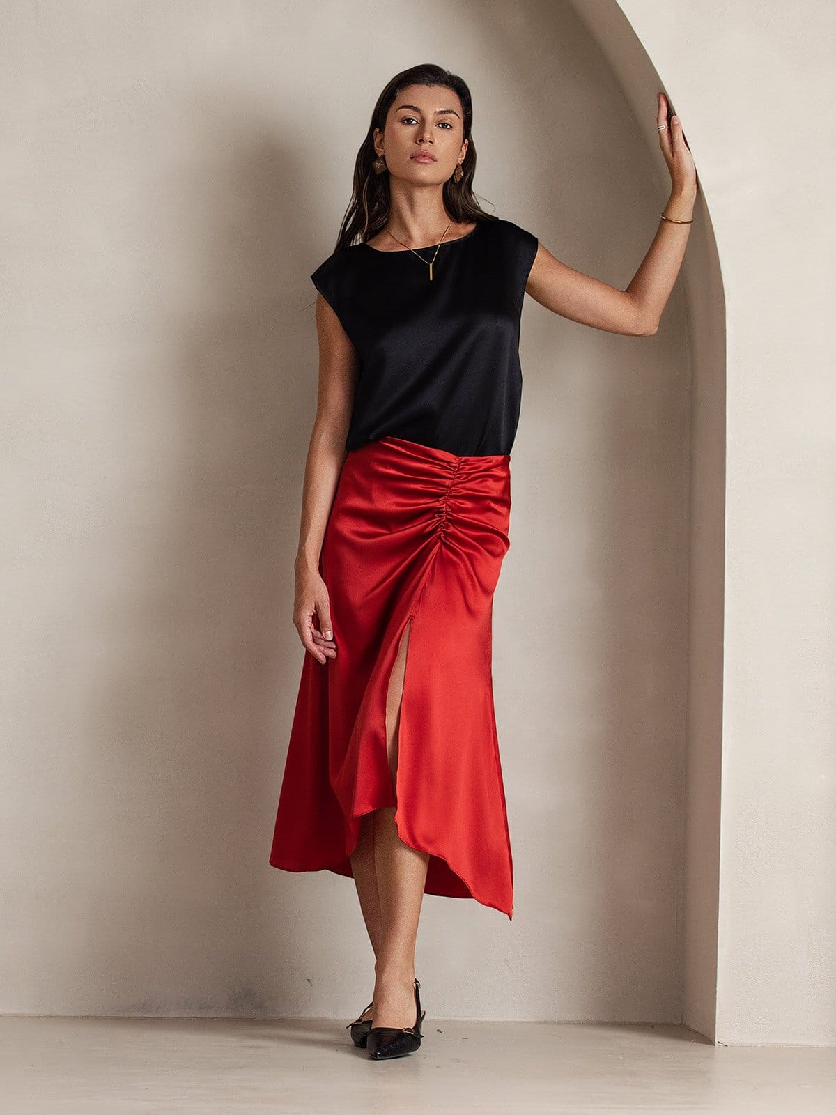Black satin sleeveless blouse with round neckline and short cap sleeves