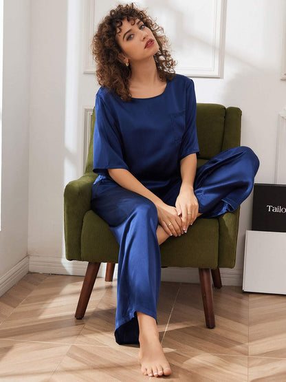 Women’s satin pajama set in dark blue: relaxed top with wide-leg drawstring pants