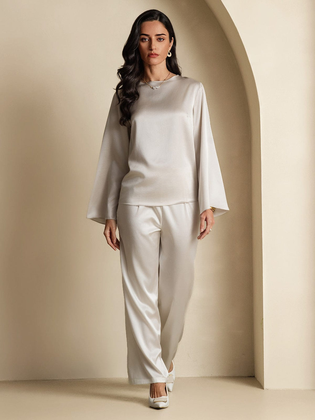 Satin long-sleeve blouse with high neckline, straight hem and flared sleeves, front view