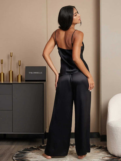 Back view of black silk wide-leg pajama set with strappy camisole top