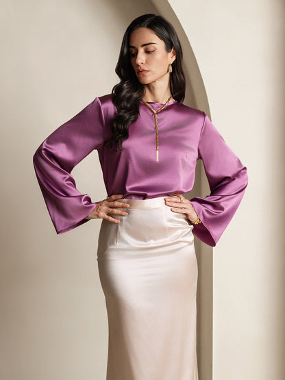 Purple satin blouse, long bell sleeves, gold cord tie at neckline