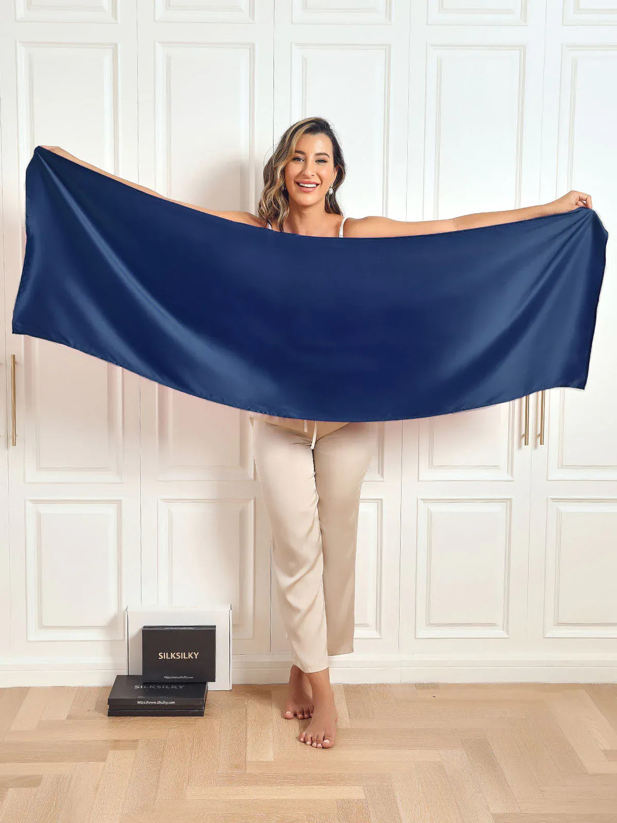 Navy satin scarf/shawl stretched wide for a long draped look