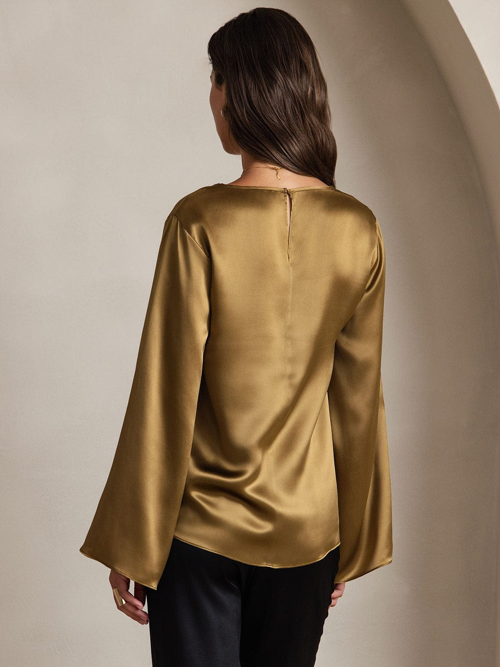Olive satin flare-sleeve blouse, back view with keyhole-style neck opening