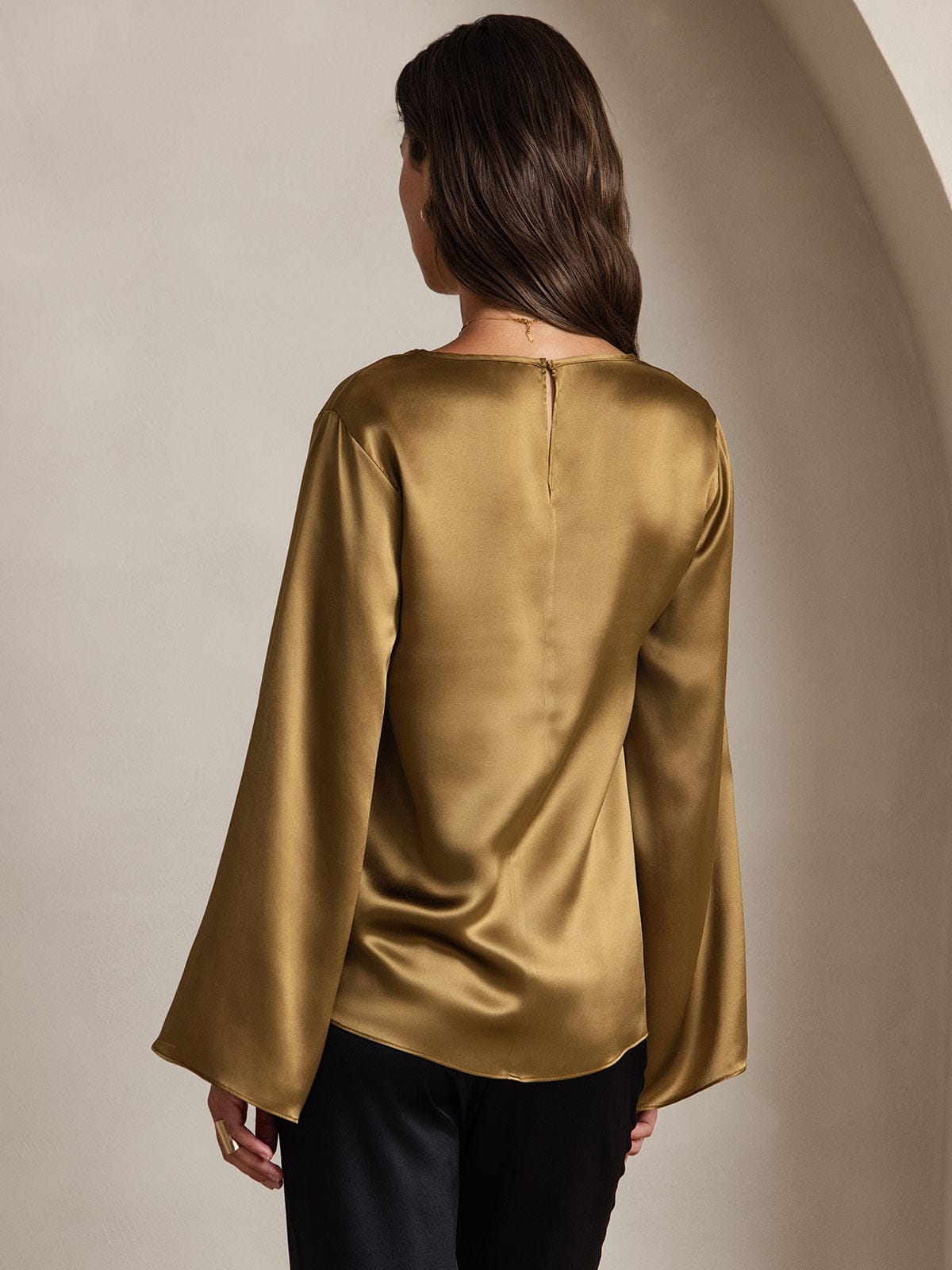 Olive satin flare-sleeve blouse, back view with keyhole-style neck opening