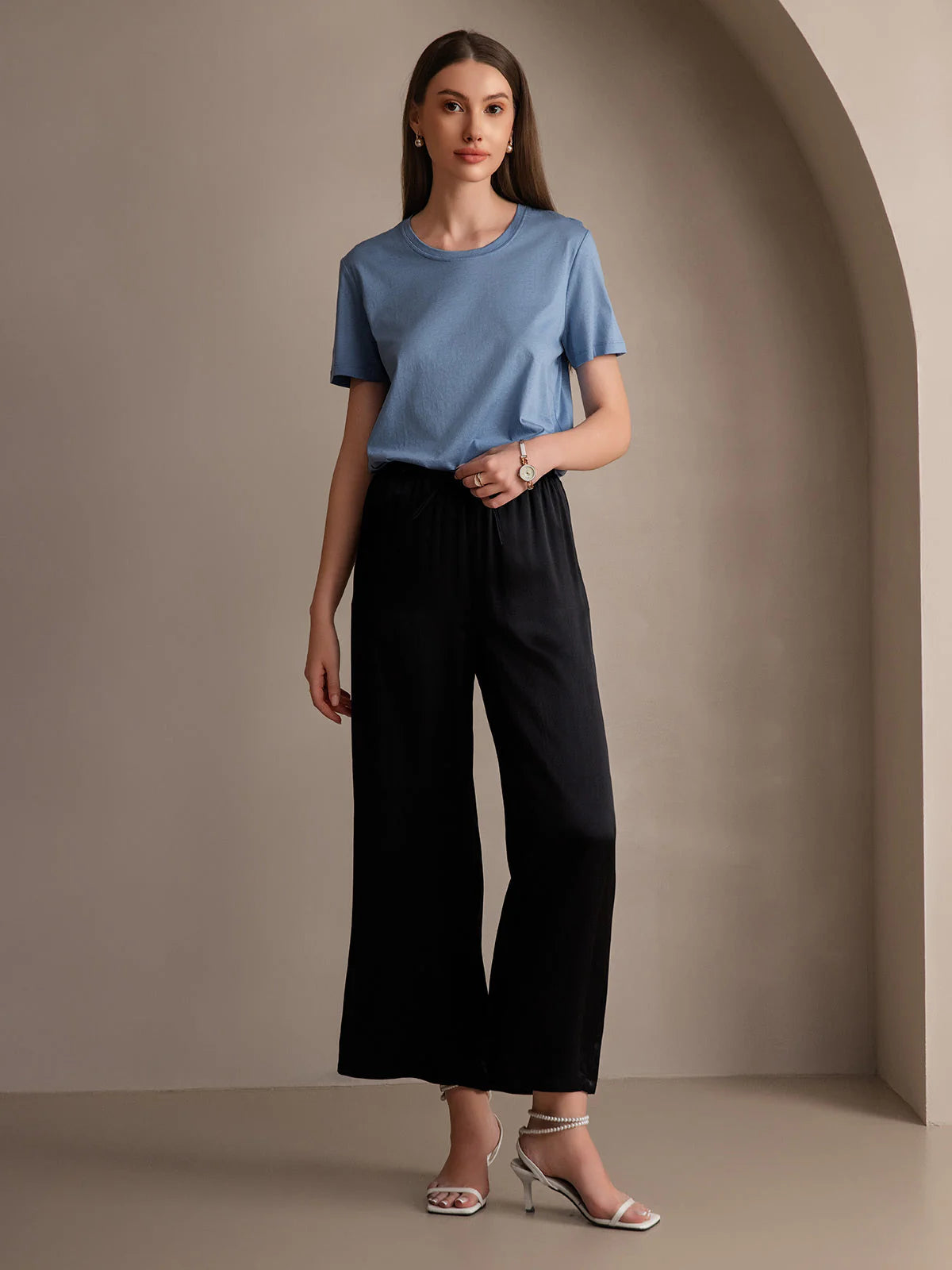 Black wide-leg elastic-waist pants with gathered waist, relaxed drape