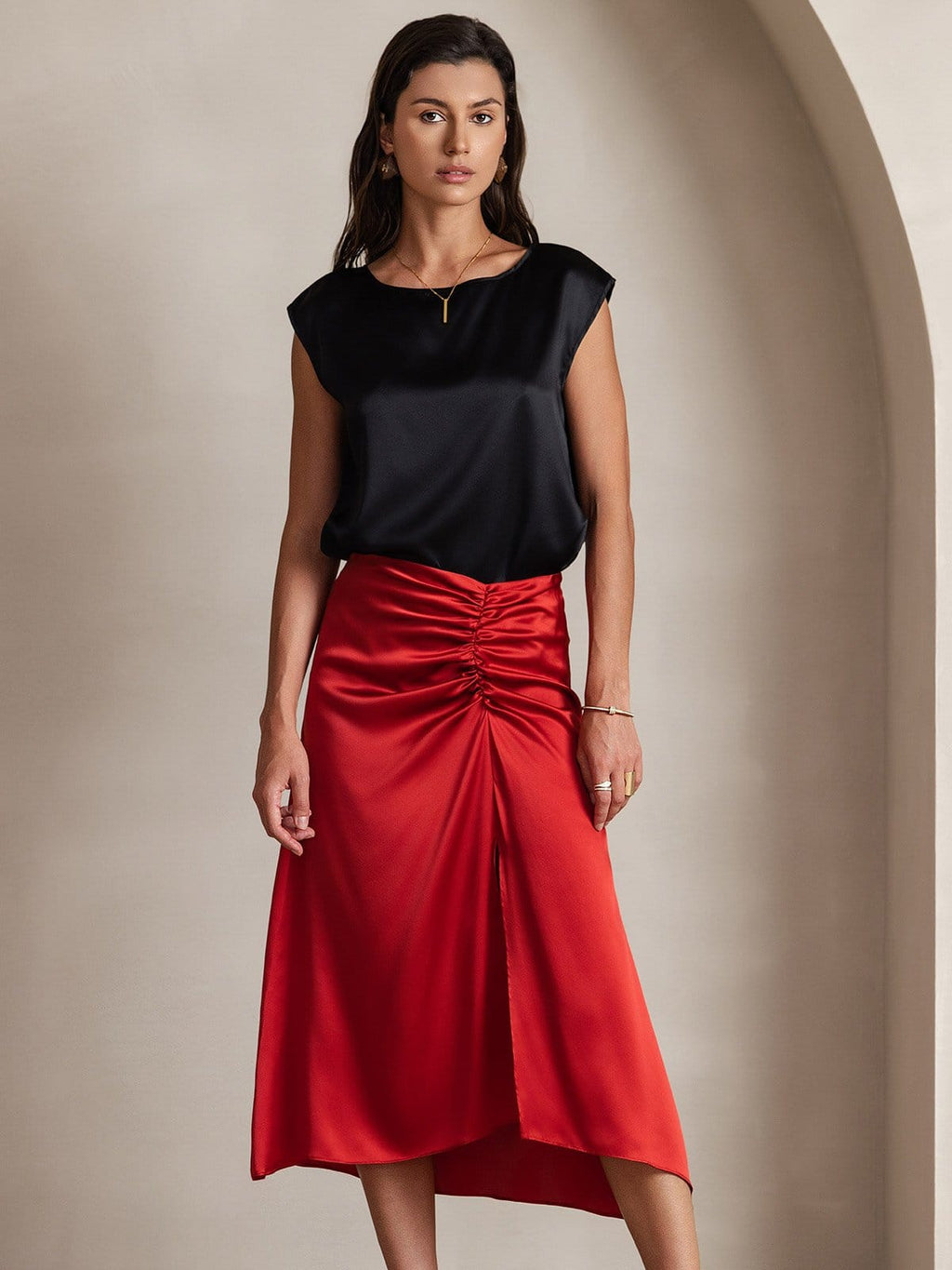 Black satin sleeveless blouse with round neckline and structured shoulder cap sleeves