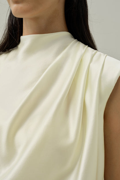 Ivory satin sleeveless blouse with smooth cowl-like front drape