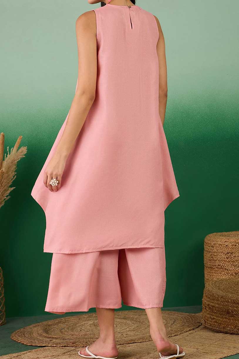 Coral linen sleeveless tunic dress with curved hem and matching midi pants
