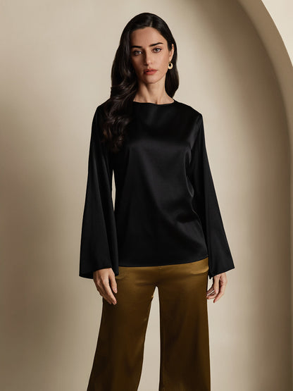 Black satin long-sleeve blouse with round neckline and flared sleeves.