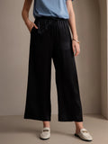 Black wide-leg elastic-waist pants with gathered waist, relaxed fit