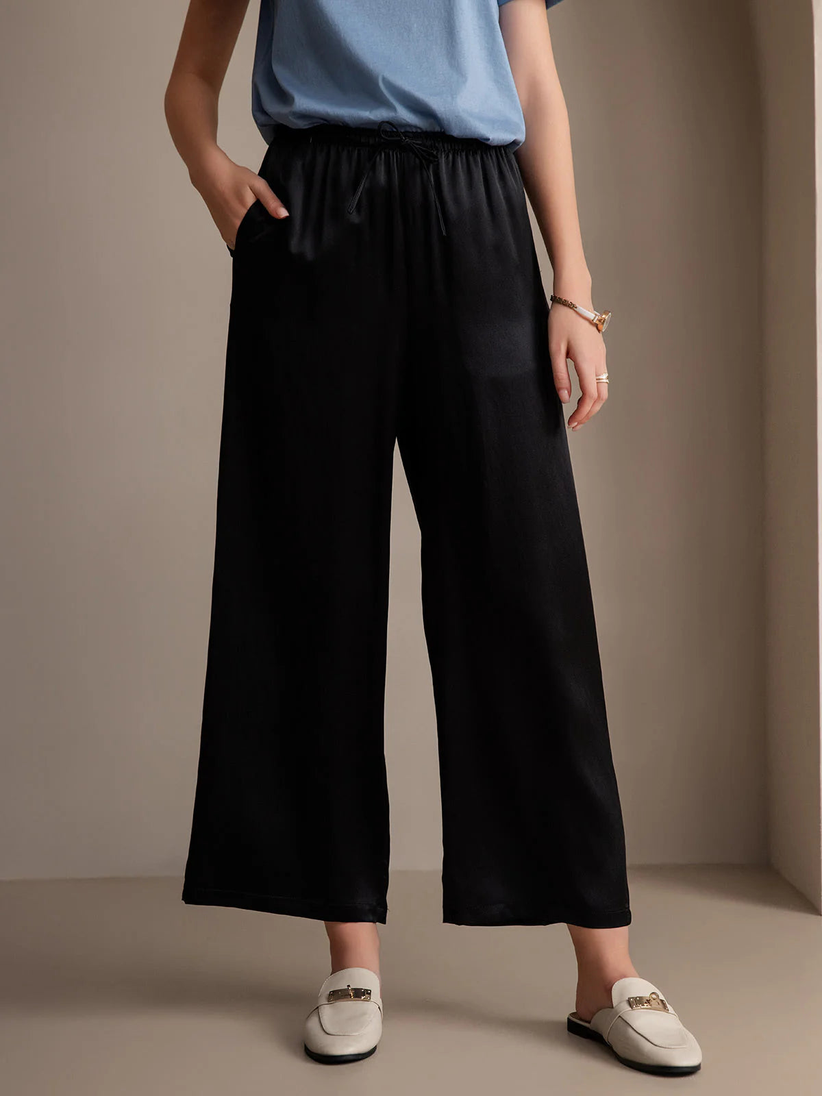Black wide-leg elastic-waist pants with gathered waist, relaxed fit