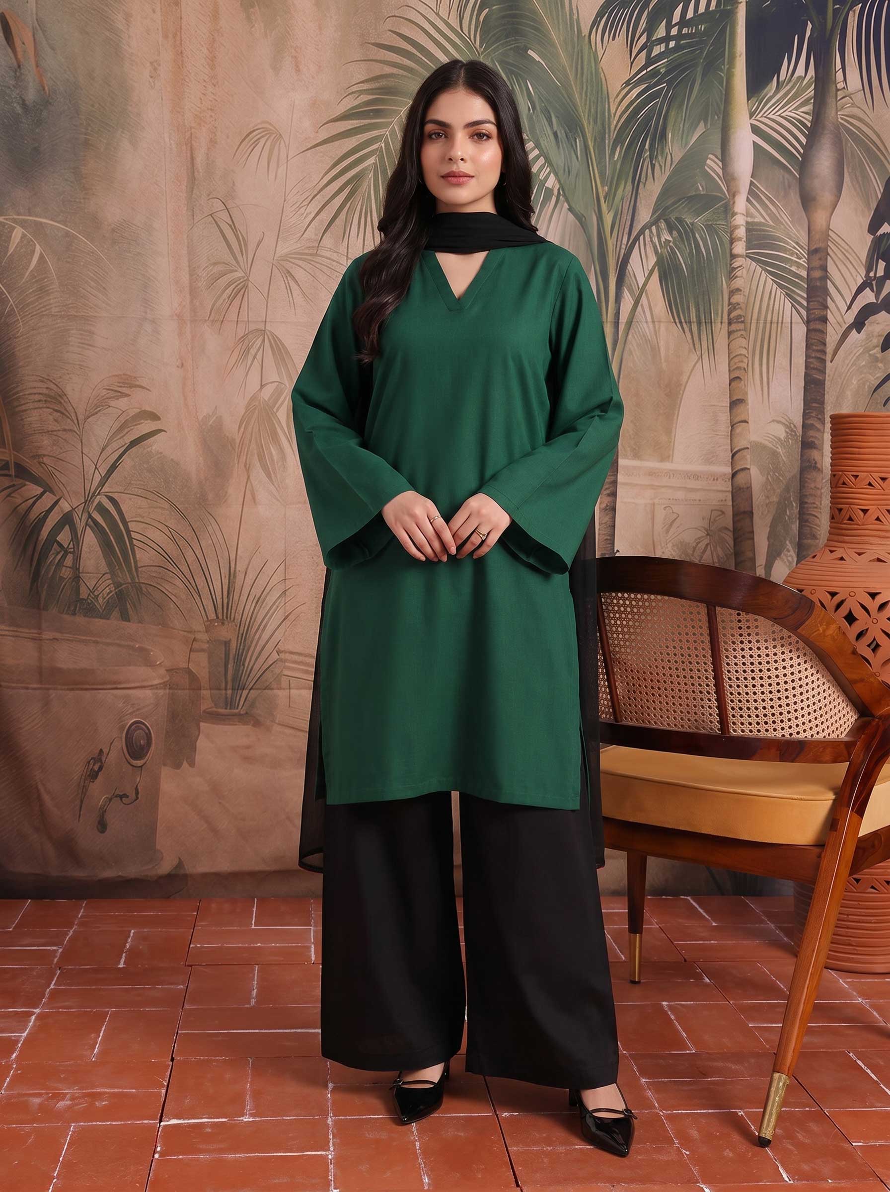 Emerald green V-neck lawn tunic with black choker and black wide-leg pants