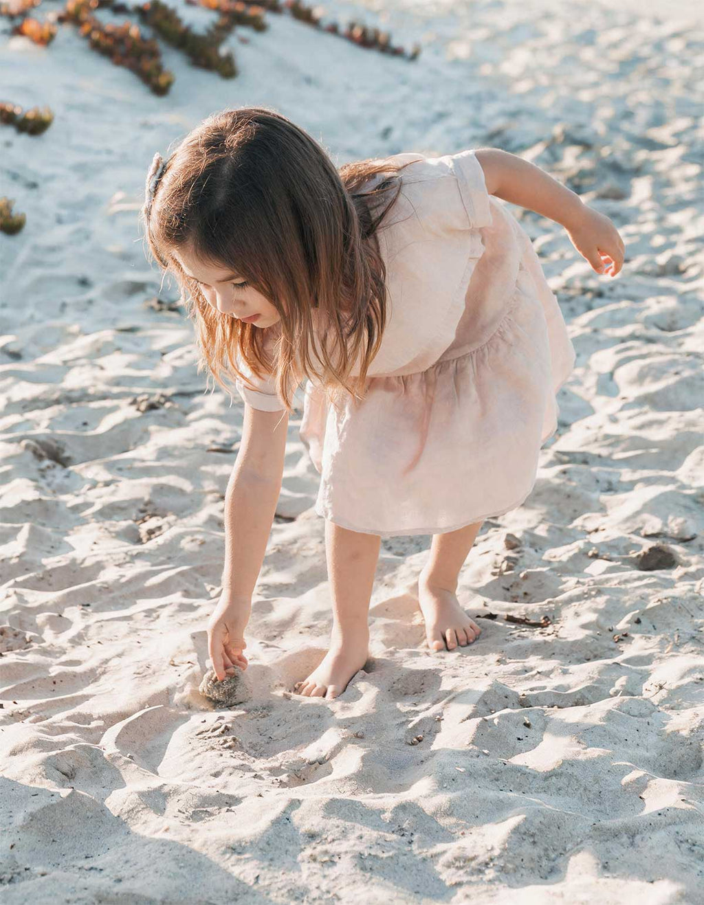 Light pink linen tiered summer frock with layered ruffles and short sleeves