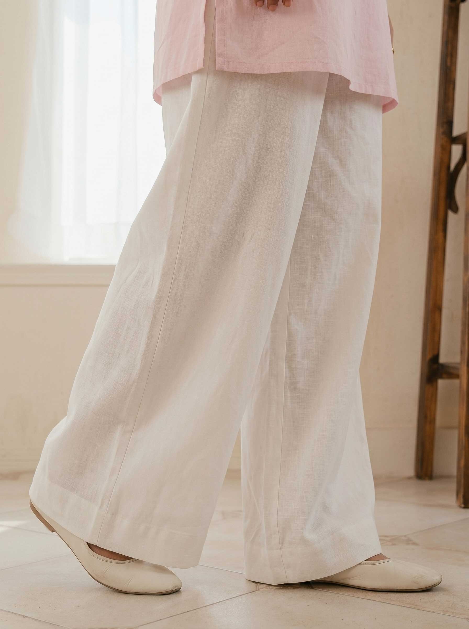 Cream wide-leg cotton trousers, relaxed fit and full length hem