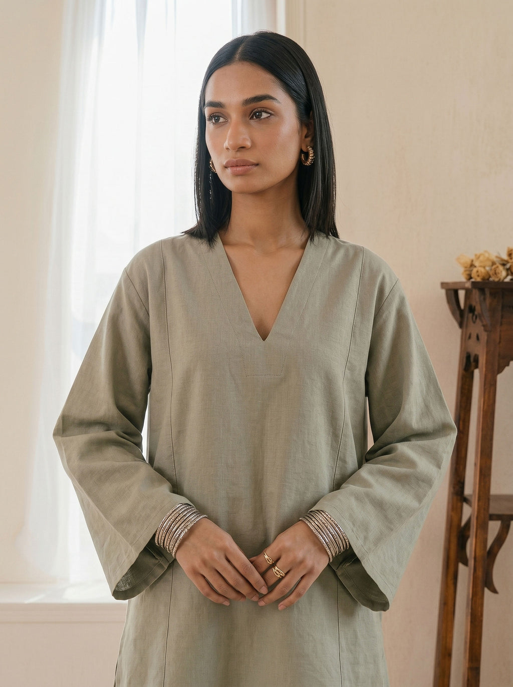 Sage green linen tunic with V-neck, long wide sleeves and relaxed straight cut