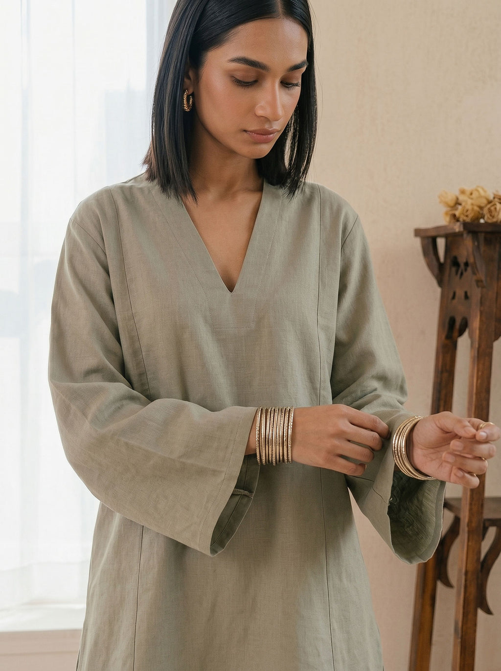 Sage green linen tunic with V-neck; wide sleeves with ruched cuff detail