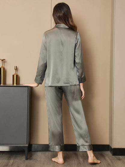 Olive silk pajama set back view with button-up shirt and cuffed straight-leg pants