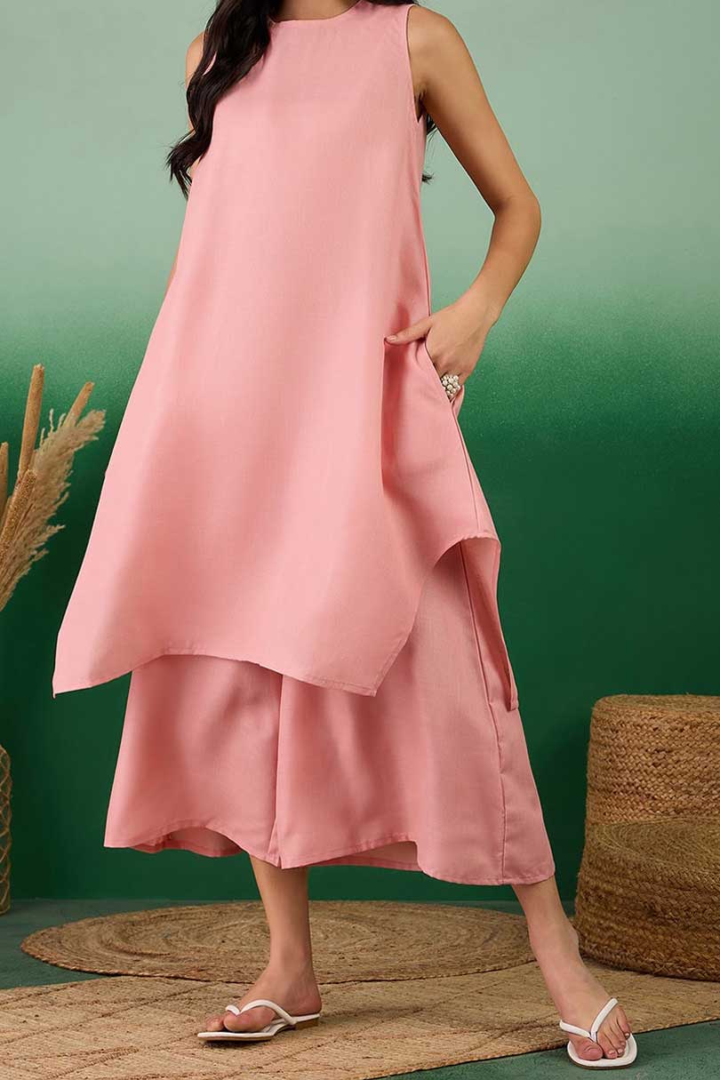 Coral linen sleeveless tunic dress over matching midi pants, side pocket