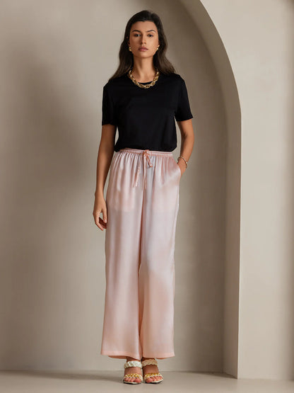 Pink silk relaxed elastic-waist pants with wide legs and center tie detail