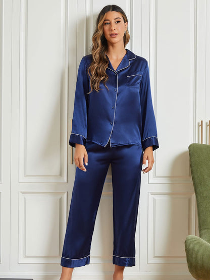 Navy silk pajama set: button-up long-sleeve top with contrast trim and wide-leg capris