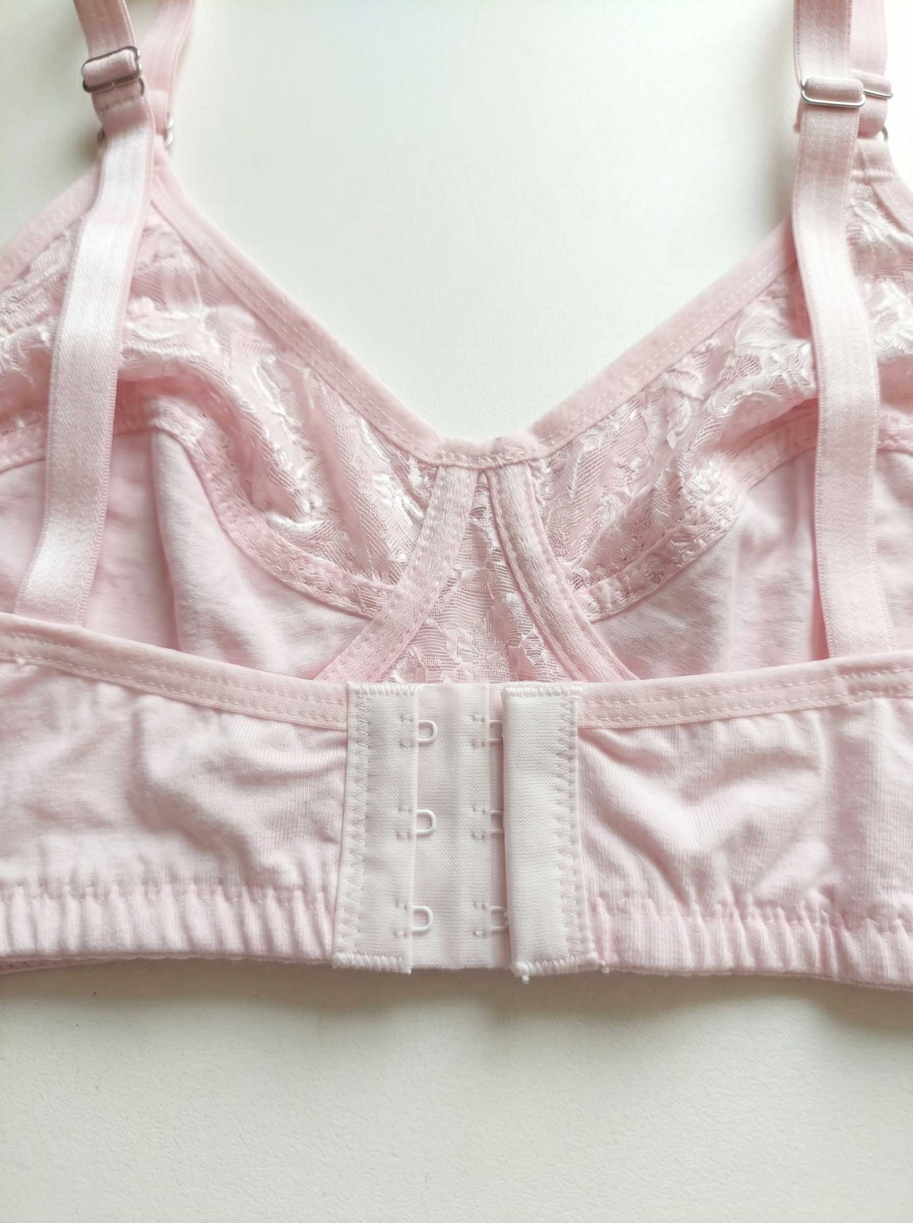 Pink wire-free lace bra close-up of back band and adjustable straps
