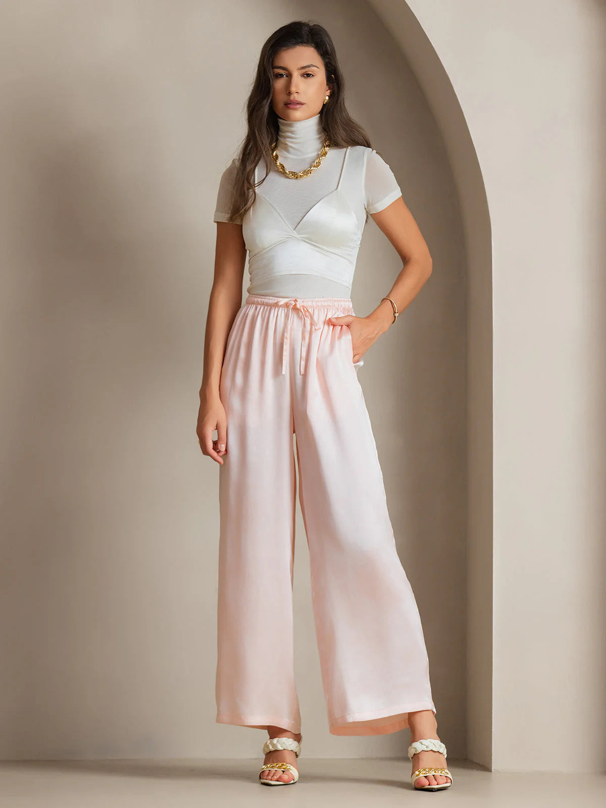 Pink silk relaxed wide-leg pants with elastic waistband and center tie detail
