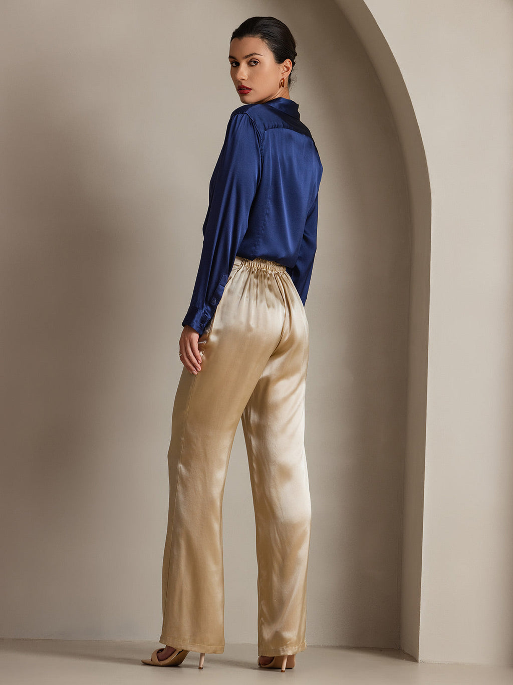 Midnight blue satin button-down shirt with point collar and long sleeves, side view