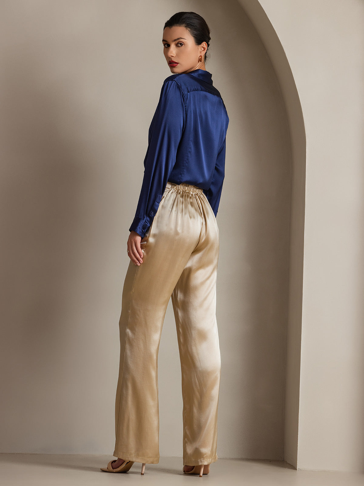 Midnight blue satin button-down shirt with point collar and long sleeves, side view