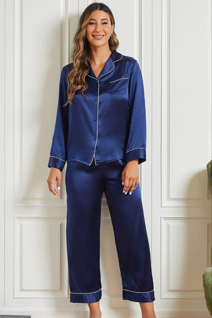 Navy silk pajama set with button-front shirt and contrast piping, matching cropped pants