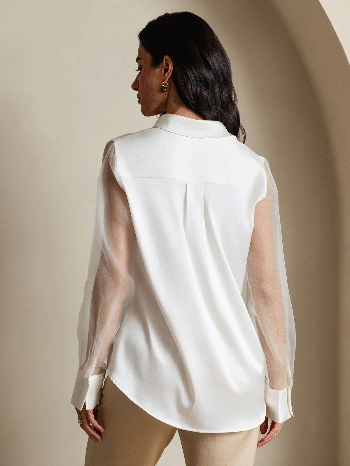 White silk blouse back view with sheer organza sleeves and concealed button placket