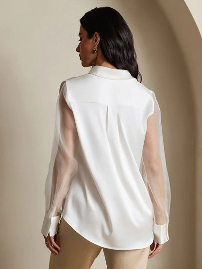 White silk blouse back view with sheer organza sleeves and concealed button placket