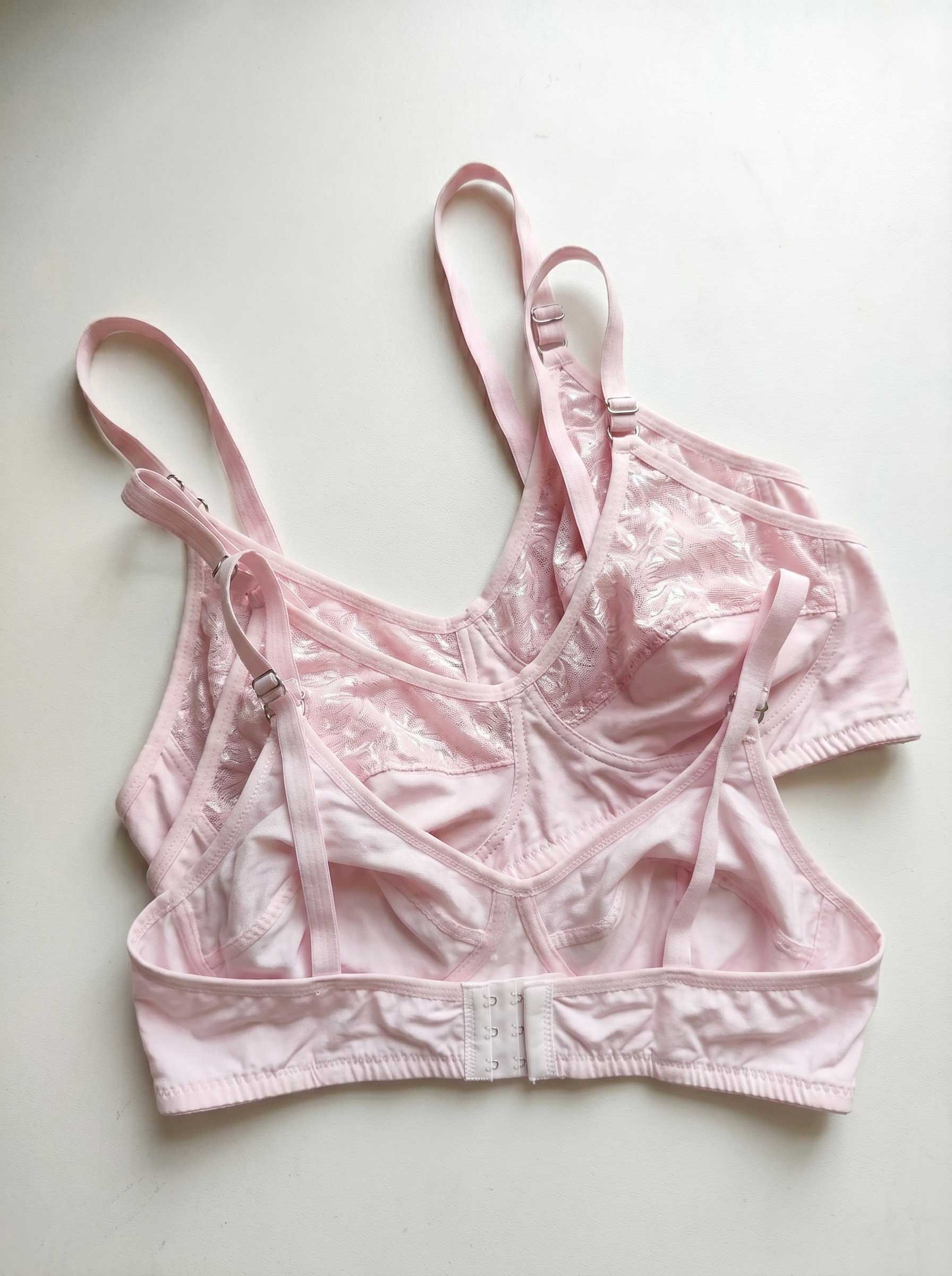 Pink wire-free lace bra with adjustable straps and front closure band