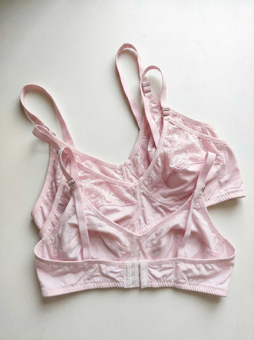 Pink wire-free lace bra with adjustable straps and front closure band