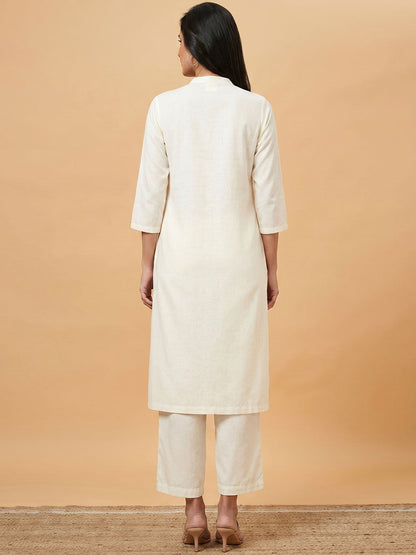 Off-white mandarin-collar long shirt with matching pants, back view